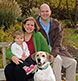 A family photographed with their dog at Mid Coast Hospital healing Garden.